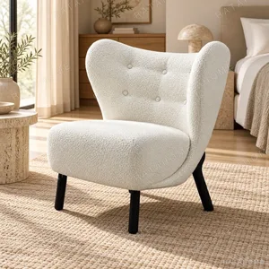 Cream Bouclé Wingback Lounge Chair on Black Wood Legs, 80 cm in oatmeal — in a room setting