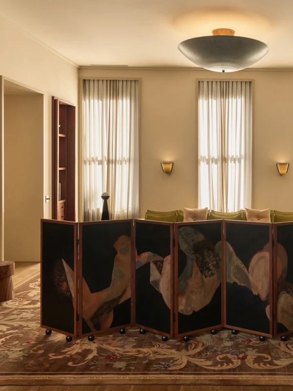 Low Walnut-Framed Art Screen on Castors in black — in a room setting