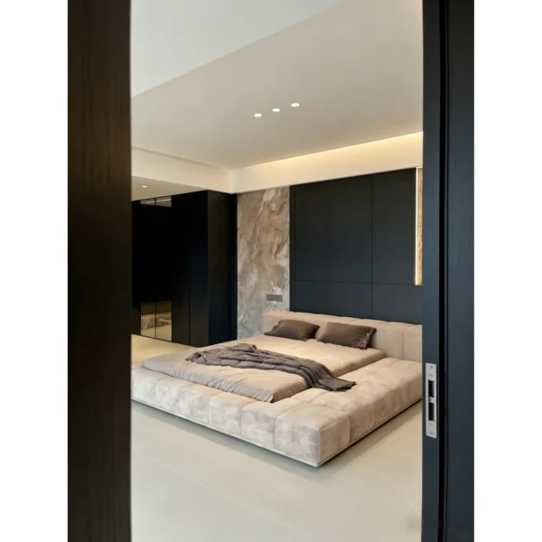 Low Wide-Ledge Upholstered Platform Bed in sand — in a room setting