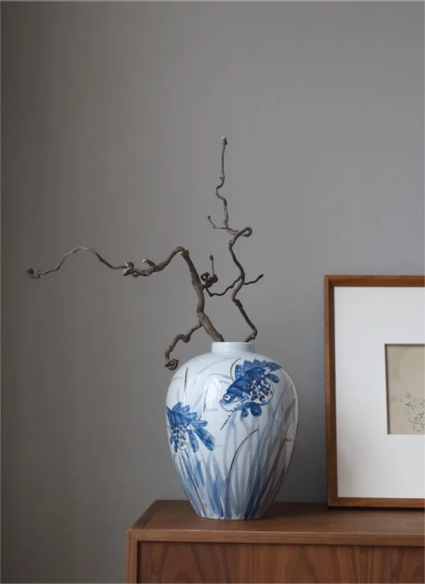Hand-Painted Blue and White Mandarin Fish Jar in blue — in a room setting