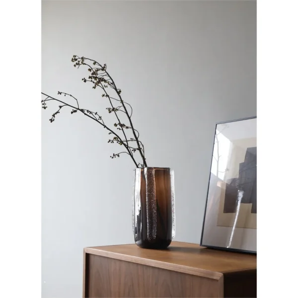 Dark Brown Glass Vase in clay — in a room setting