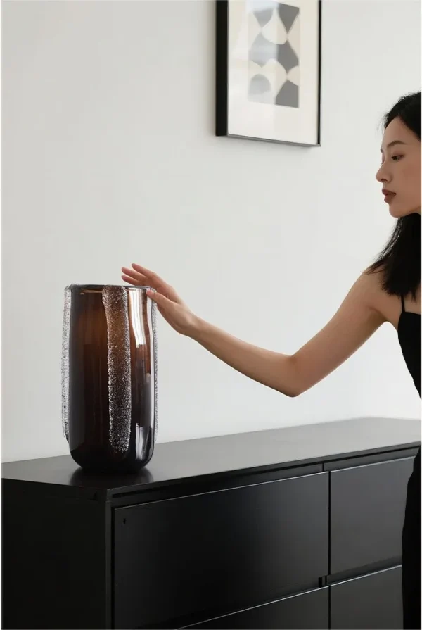 Dark Brown Glass Vase in clay — in a room setting