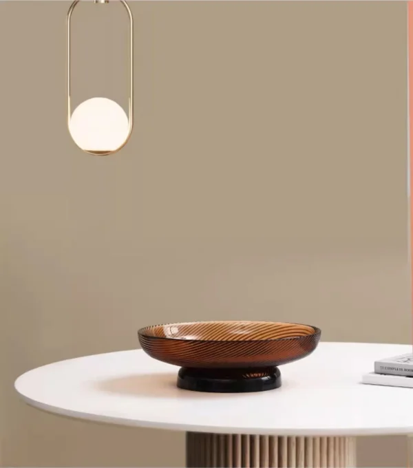 Ribbed Amber Glass Footed Fruit Bowl, Short or Tall in clay — in a room setting