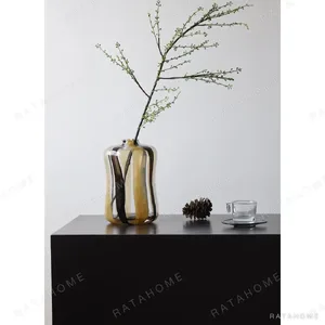 Striped Cast Glass Vases in mustard — in a room setting