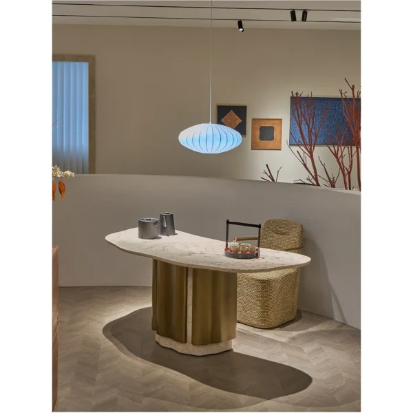 French Pink Stone Tea Table on Bronze Column in rose stone — in a room setting