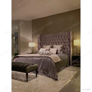 Magical Tall Button-Tufted Velvet Bed in plum — in a room setting
