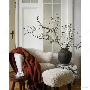 Rustic Iron-Glaze Round Jar Vase for Magnolia Branches in clay — in a room setting