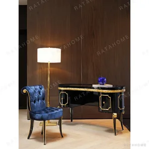 Makayla Black and Gold Carved Vanity Table with Velvet Chair in black — in a room setting