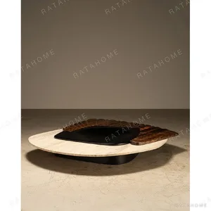 Mara Travertine and Carved Wood Coffee Table, 190 x 165 cm in oatmeal — in a room setting