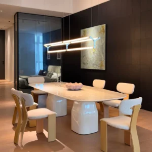 Rounded Rectangular Marble Dining Table on Pedestal Base in oatmeal — front view