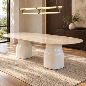 Rounded Rectangular Marble Dining Table on Pedestal Base in oatmeal — in a room setting