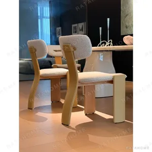 Rounded Rectangular Marble Dining Table on Pedestal Base in oatmeal — in a room setting