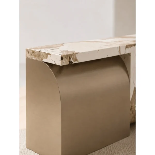 Curved Marble Reception Desk with Brushed Metal Wrap in sand — in a room setting