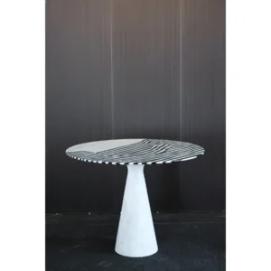 Black and White Striped Marble Round Table in black — in a room setting