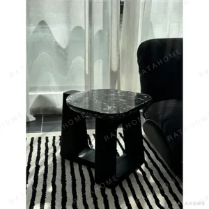 Black Marble Side Table on Black Geometric Wood Base in black — in a room setting