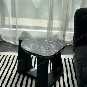 Black Marble Side Table on Black Geometric Wood Base in black — in a room setting