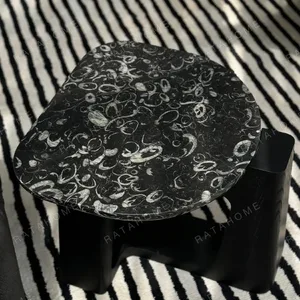 Black Marble Side Table on Black Geometric Wood Base in black — in a room setting