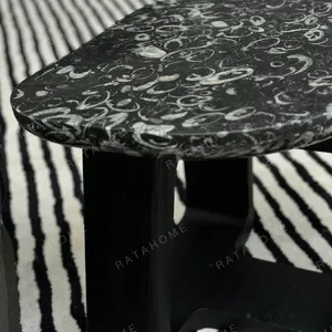 Black Marble Side Table on Black Geometric Wood Base in black — in a room setting
