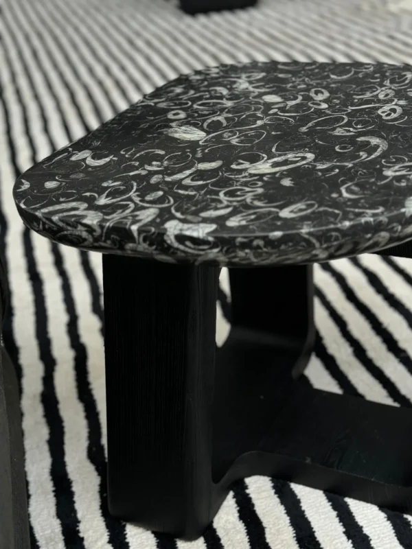 Black Marble Side Table on Black Geometric Wood Base in black — in a room setting