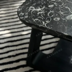 Black Marble Side Table on Black Geometric Wood Base in black — in a room setting