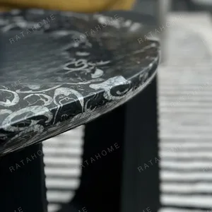 Black Marble Side Table on Black Geometric Wood Base in black — in a room setting