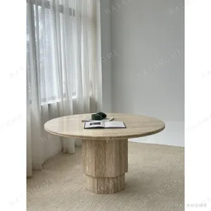Sealed Travertine Round Dining Table on Fluted Column in oatmeal — in a room setting