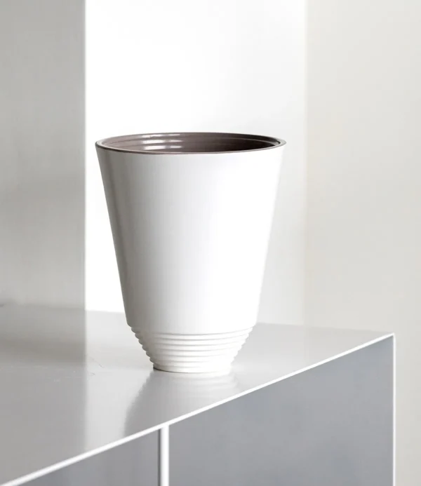 Matte White Cone Ceramic Vase with Spiral-Ribbed Base in ivory — in a room setting