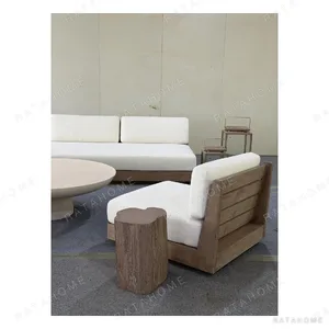 Floating Teak Outdoor Modular Sofa Set with Swivel Chairs in clay — in a room setting