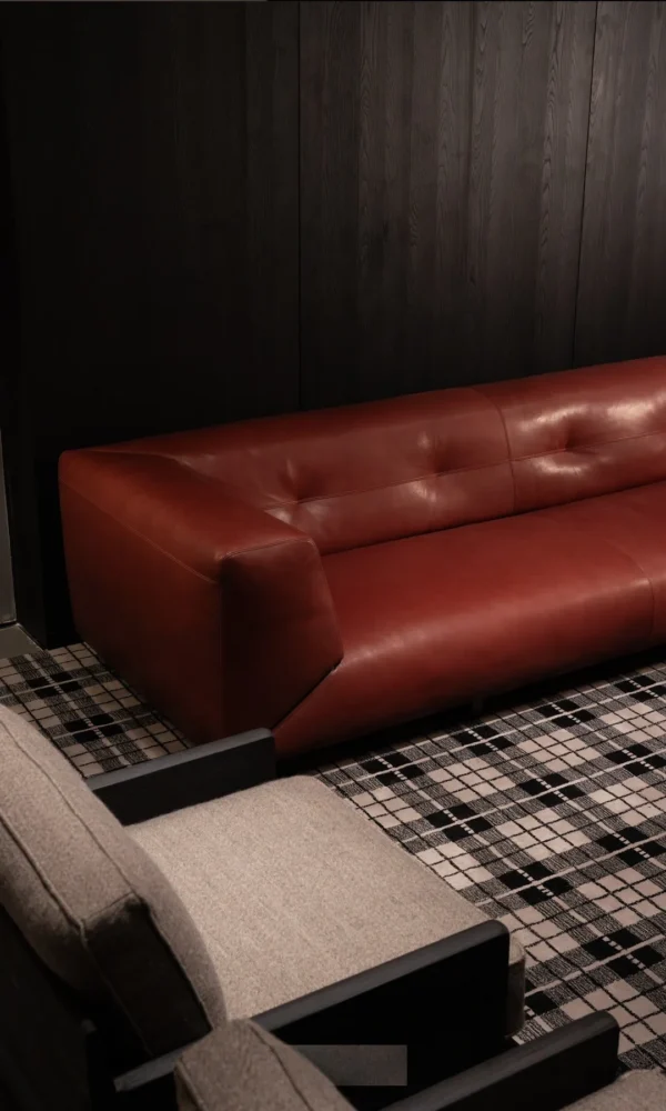 Quiet Luxury Sofa in Cognac Aniline Bull Leather — in a room setting