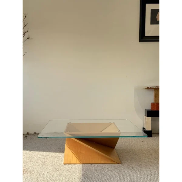 Twisted Wood Base Square Glass Coffee Table in natural oak — in a room setting