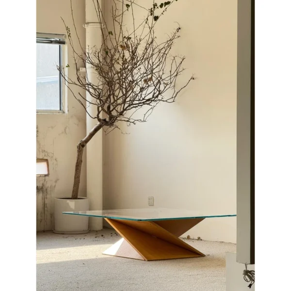 Twisted Wood Base Square Glass Coffee Table in natural oak — in a room setting