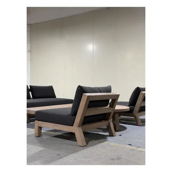Solid Teak Outdoor Sofa Set with Navy Cushions in natural oak — in a room setting