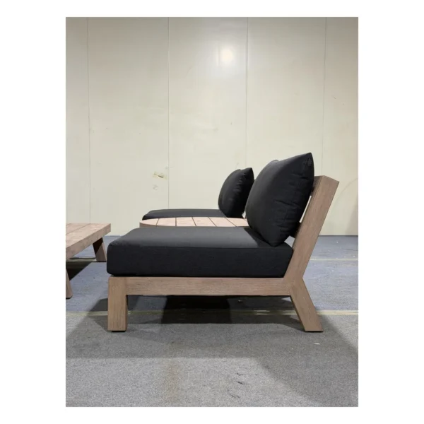 Solid Teak Outdoor Sofa Set with Navy Cushions in natural oak — in a room setting