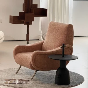 Curved Blush Fabric Lounge Chair on Slim Metal Legs in rose stone — front view