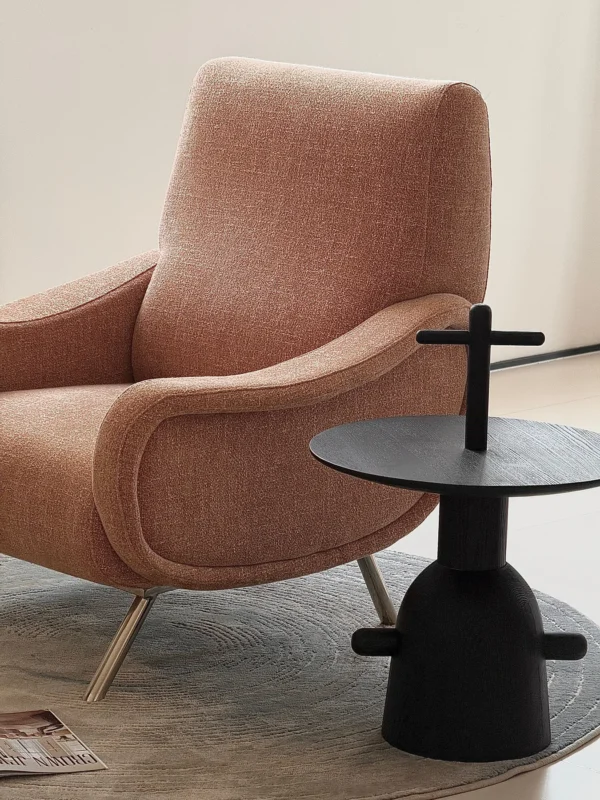 Curved Blush Fabric Lounge Chair on Slim Metal Legs in rose stone — in a room setting