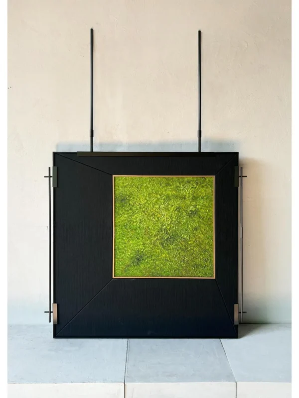 Metal Frame Green Moss Wall Art on Hanging Rods in olive — in a room setting