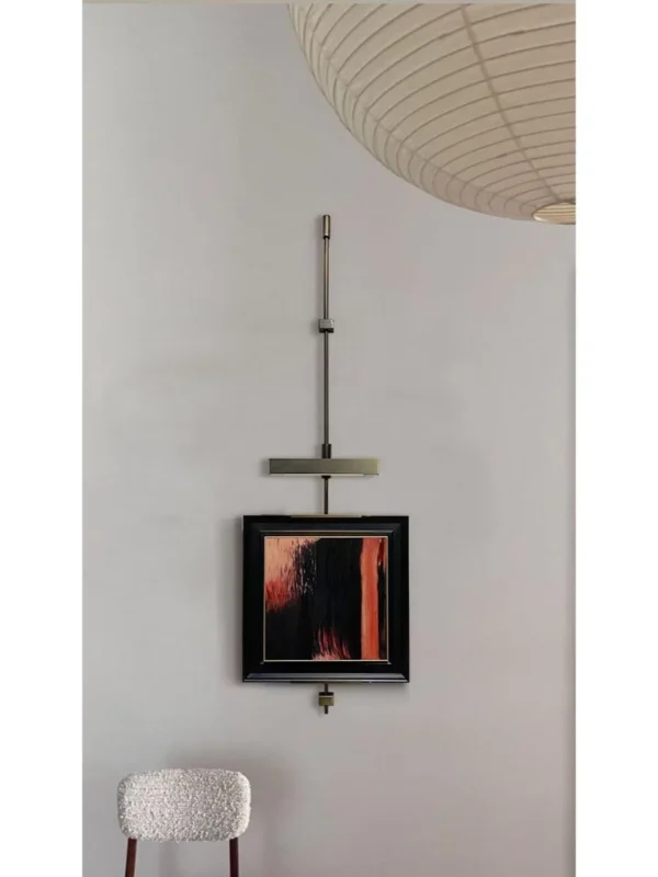 Metal Frame Wall Art on Hanging Rod, Red and Black Abstract in red — in a room setting