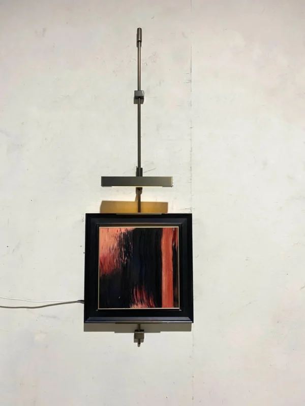 Metal Frame Wall Art on Hanging Rod, Red and Black Abstract in red — in a room setting