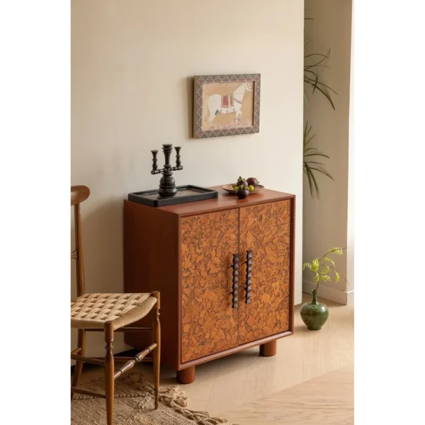 Mid-Century Amber Burl Cabinet with Sculpted Wood Pulls in rust — in a room setting