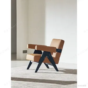 V-Leg Black Ash Armchair in Tan Fabric — in a room setting