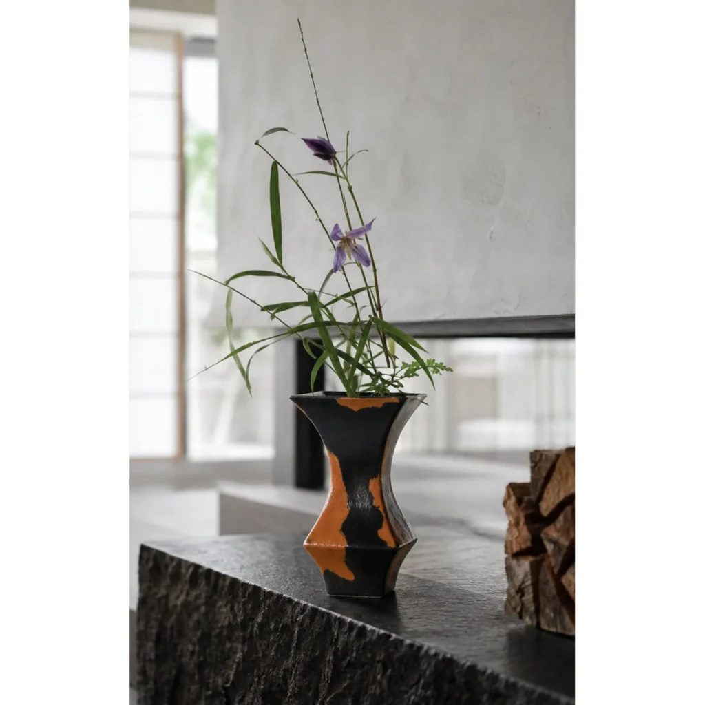 Mid-Century Black and Rust Kiln-Change Angular Vase in black — in a room setting