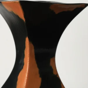 Mid-Century Black and Rust Kiln-Change Angular Vase in black — in a room setting