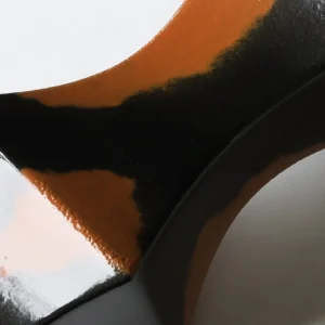Mid-Century Black and Rust Kiln-Change Angular Vase in black — in a room setting