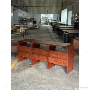 Mid-Century Burl Veneer Waterfall Sideboard in rust — in a room setting