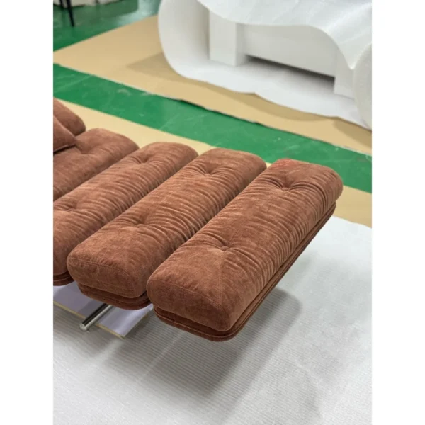 Mid-Century Ribbed Chaise Lounge in rust — in a room setting