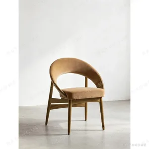 Mid-Century Curved-Back Dining Chair in Camel Velvet — in a room setting