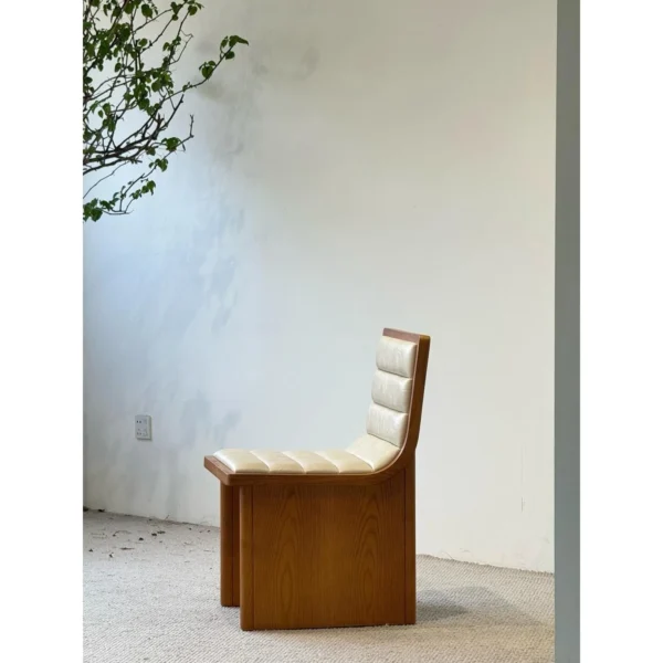 Walnut-Tone Ash Dining Chair in walnut — in a room setting