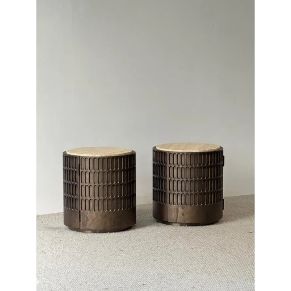 Distressed Carved Drum Nightstand with Travertine Top in clay — in a room setting