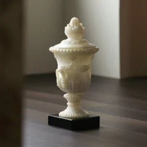 Jade-Effect Roman Lidded Urn Ornament on Black Base in oatmeal — front view
