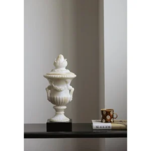 Jade-Effect Roman Lidded Urn Ornament on Black Base in oatmeal — in a room setting